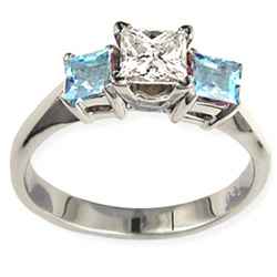 Engagement ring with Princess side Aquamarines