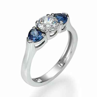 Engagement ring with two Heart Blue Sapphires
