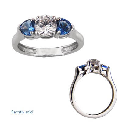 Engagement ring with two Heart Blue Sapphires