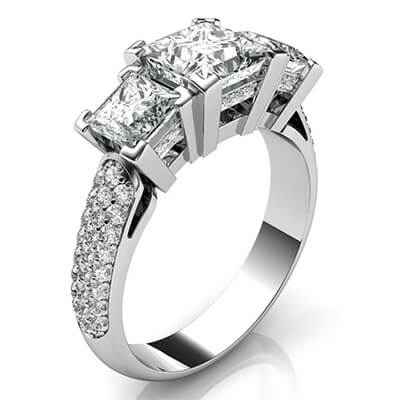 Three Princess diamonds engagement ring encrusted with diamonds