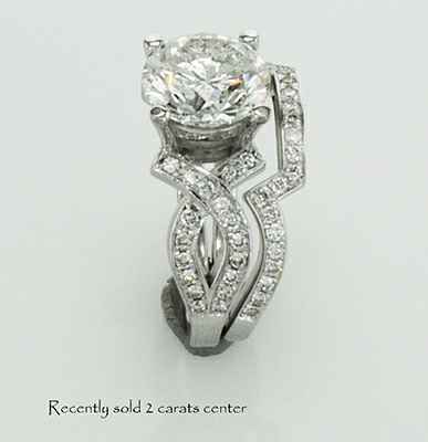 Bowtie engagement ring 0.25CTW side diamonds