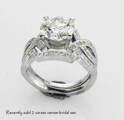 Bowtie engagement ring 0.25CTW side diamonds