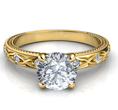 Leaf motif vintage style engagement ring with side diamonds