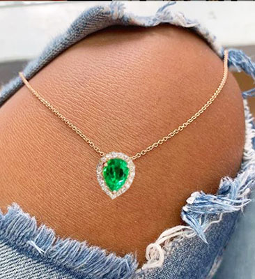 Emerald 6x8 mm pendant with diamonds