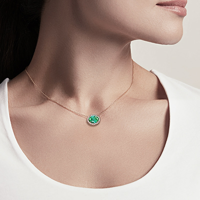 1 1/4 carat Oval Emerald and 1/5 carat diamonds pendant