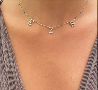 Three letters necklace, 0.50 carat diamonds average G color VS2 clarity