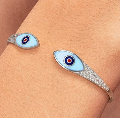 Solid Gold bangle with 0.65 carat diamonds and Enamel eyes