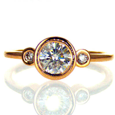 Bezel set Engagement ring with side diamonds, tailored to your chosen diamond