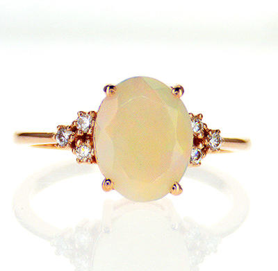 1.50 carat Opal engagement ring with diamonds