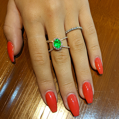 1.20 Emerald  Oval shape, X ring set with 1/2 carat side natural diamonds  average G VS